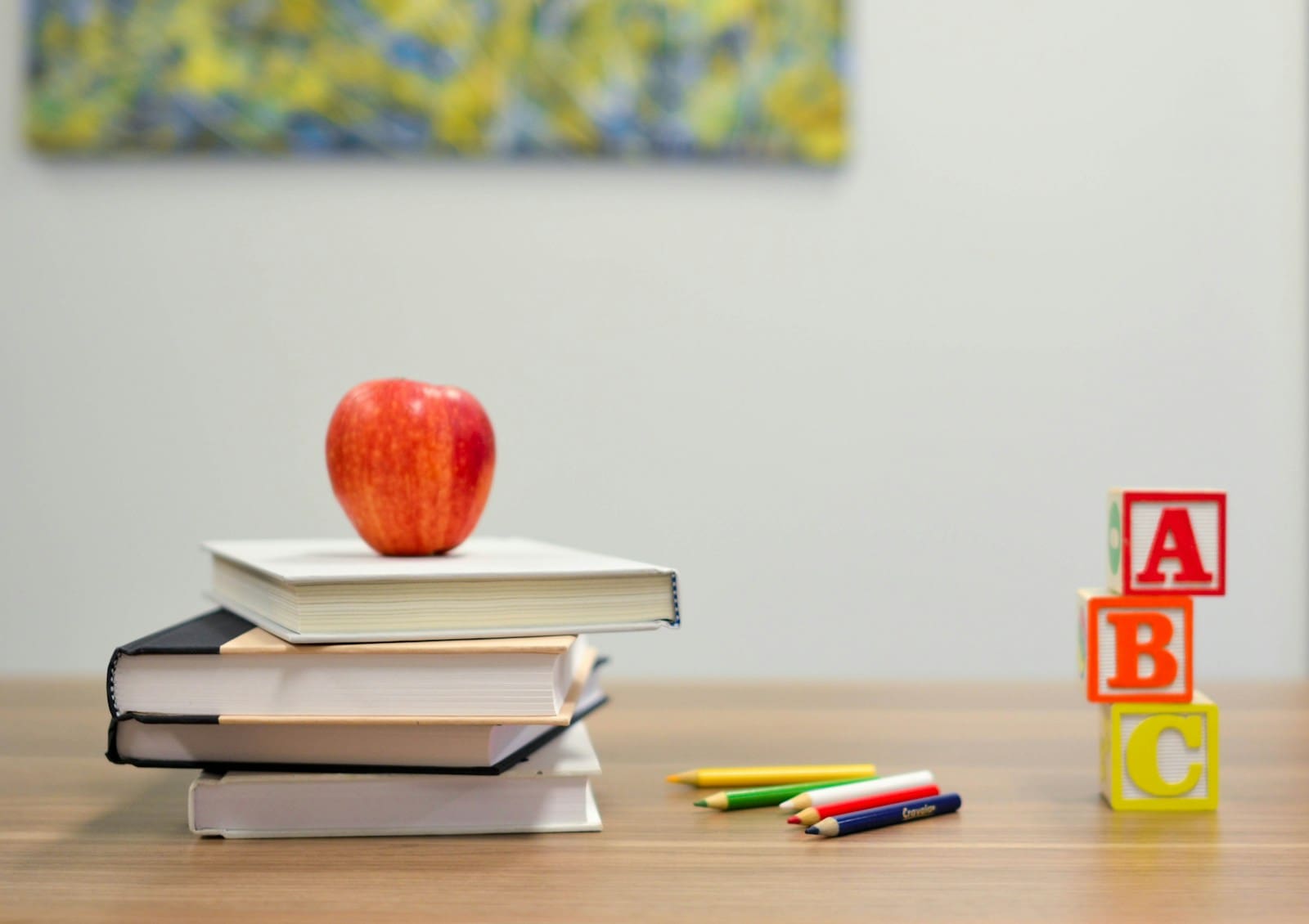 A parent and child working through maths together at a kitchen table — home education